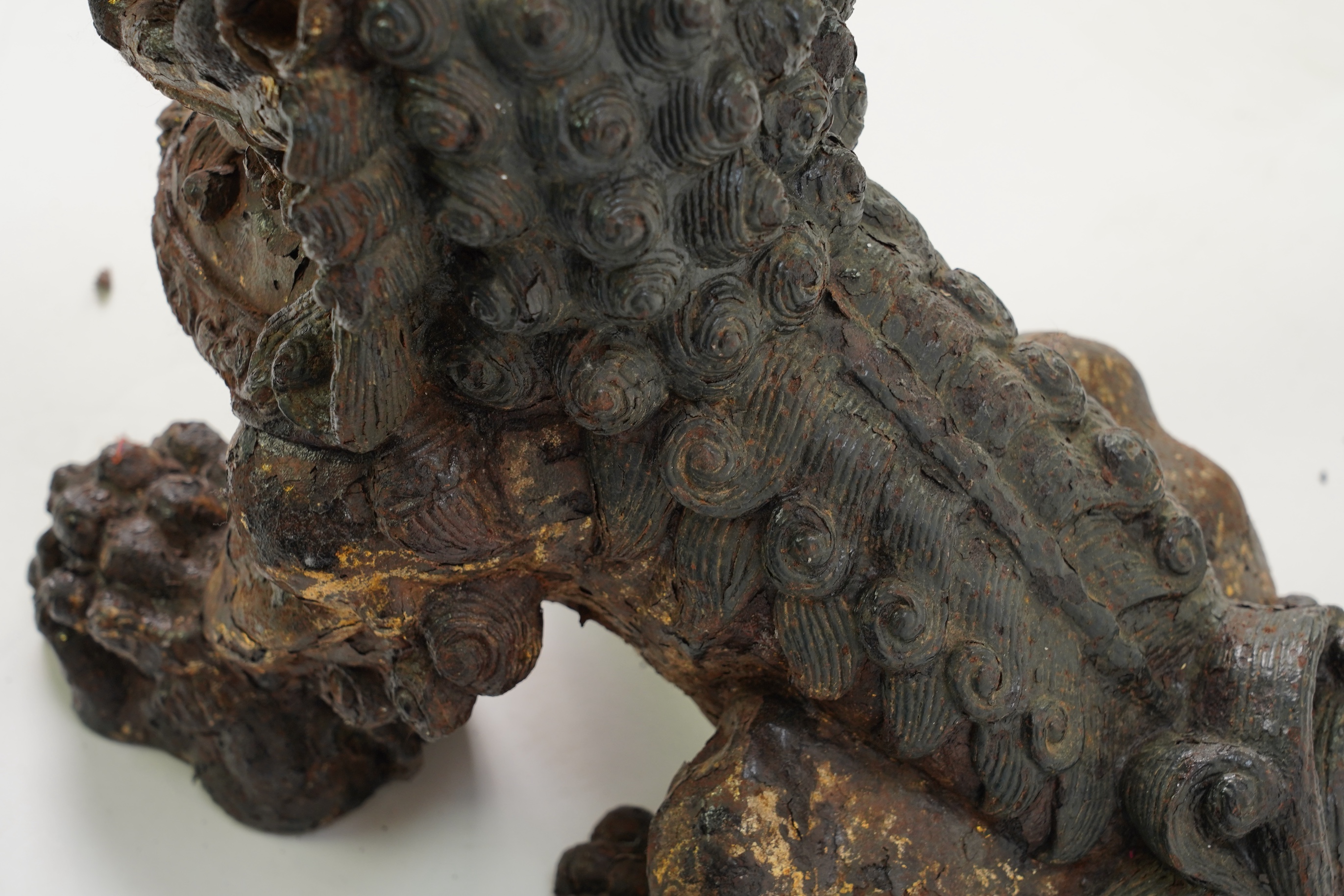 A pair of large Chinese polychrome lacquered cast iron models of lion temple guardians, Qing dynasty